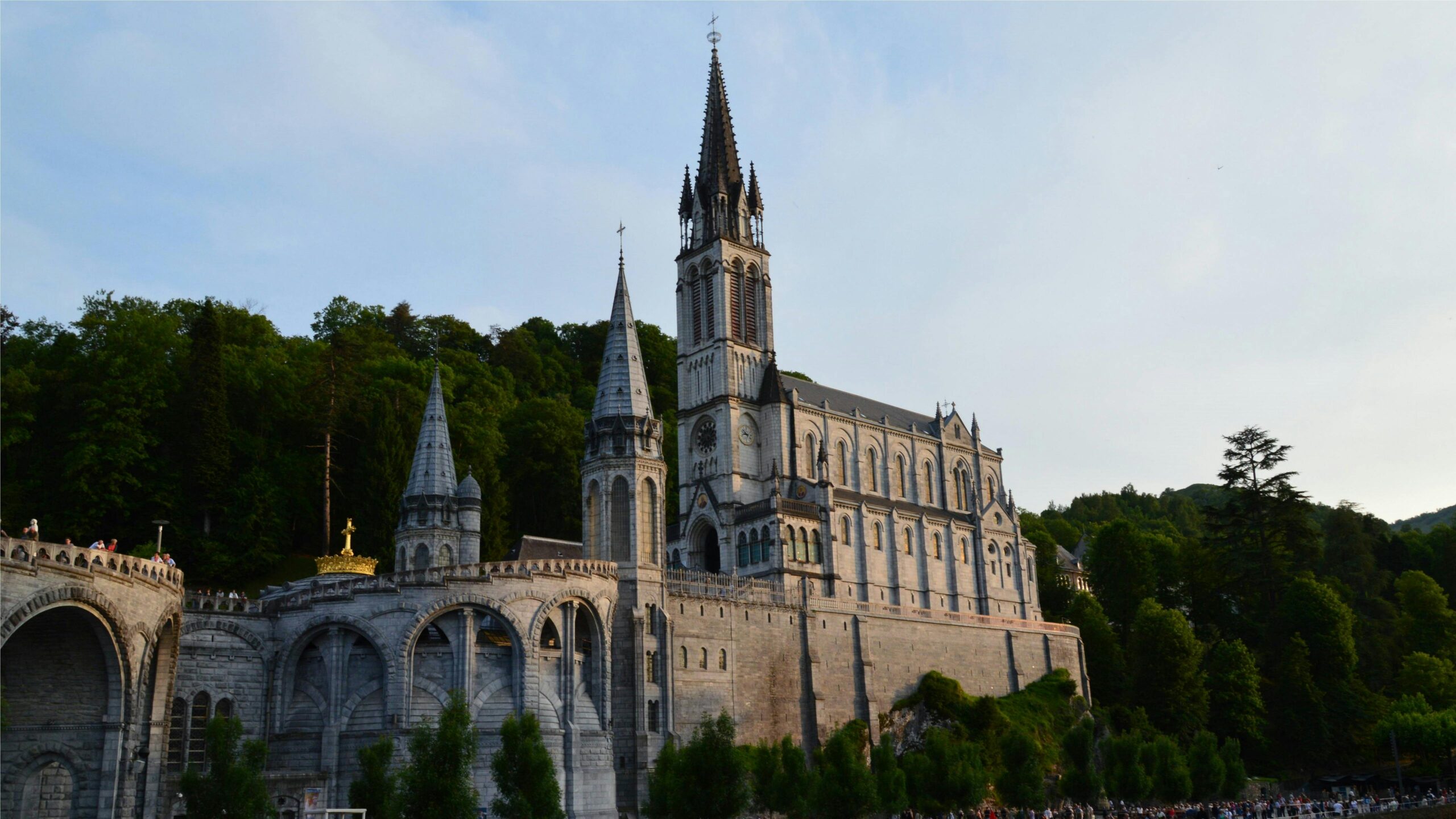 Majestic view of the Rosary Basilica in Lourdes, France, at daytime.